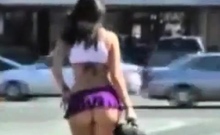 Sexy girl in short skirt on the street.